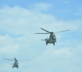 Fototapeta na wymiar helicopters flying in the sky