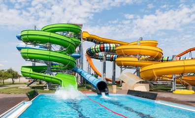 Water park with colorful slides and pools