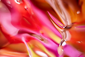Abstract multi-colored image. Red, yellow and pink shades. Gel in macro.