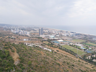Fototapeta premium Israel, Haifa Southern District. Aerial panoramic view on a cloudy day.