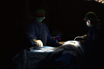 Medical Team Performing Surgical Operation in Modern Operating Room. Equipment and medical devices...