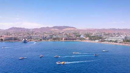 Obraz premium Speed Boats and Jetskies in the sea Aerial footage