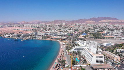 Fototapeta na wymiar Eilat Shorline with Marina Boats Hotels and landscape Aerial
