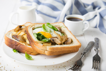Breakfast sandwich. Fried eggs with toast