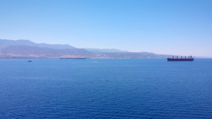 Jordan Mountains and red sea, with large tanker ship