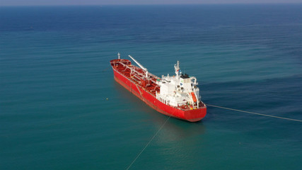Drone view of oil Chemical Tanker Tied with strings Close to port Aerial Footage, Ashdod, Israel