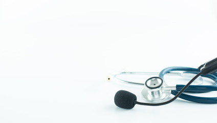 Stethoscope and headphone with microphone in emergency call concept.
