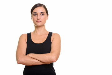 Studio shot of beautiful woman with arms crossed