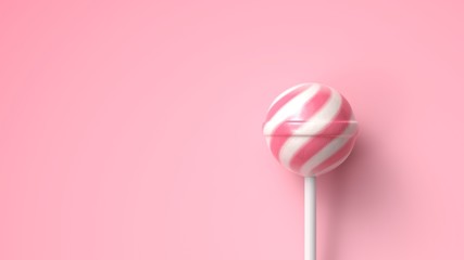 Striped fruit pink and white lollipop on stick on bright pink background with copy space