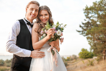 Happy couple celebrating their wedding outdoors