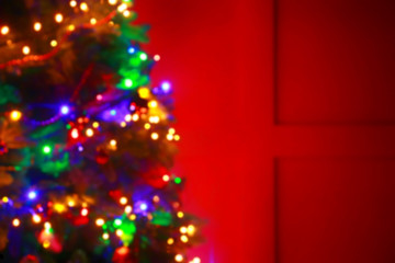 Beautiful decorated Christmas tree at night, blurred view