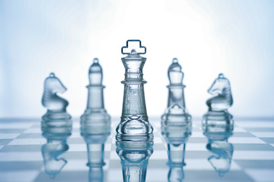 Transparent glass chess isolated on white