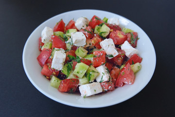 Fototapeta na wymiar Tomato and Feta Cottage Cheese Salad. Greek salad