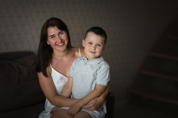 crazy funny mom and son on the floor in room