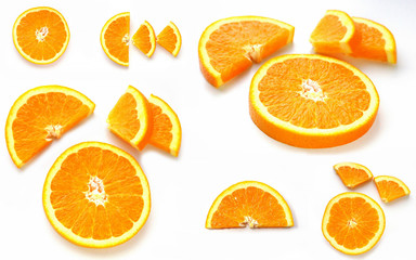 Sliced ​​Orange. Different shaped pieces of fruit.