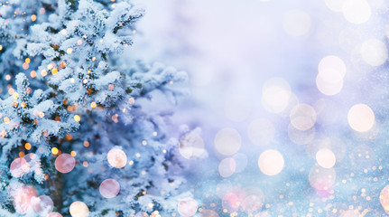 Obraz na płótnie Canvas Christmas and New Year holidays background, greeting card. Glitter lights backdrop. Winter season. Text space. Closeup of Christmas-tree.