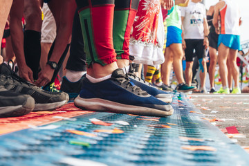 Athletes legs close-up in front of the start line