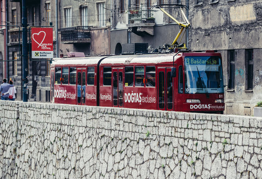 Sarajevo, Bosnia and Herzegovina - August 23, 2015: red tram car at Obala Kulina Bana Street in Sarajevo city