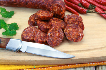 whole chorizo on a cutting board