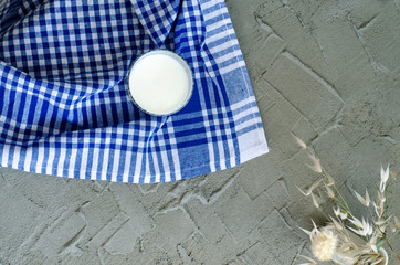 milk in glass on concrete background