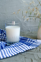 milk in glass on concrete background