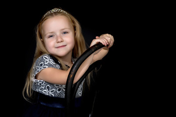Little girl on a black background