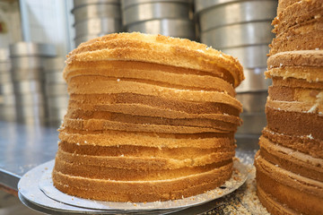 sponge cake cut and piled on worktop