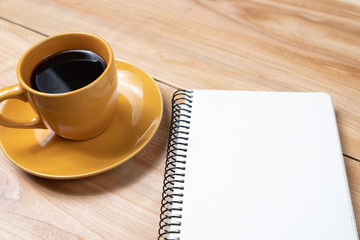 cup of black flavored coffee on wooden background notebook plan day break business meeting negotiation