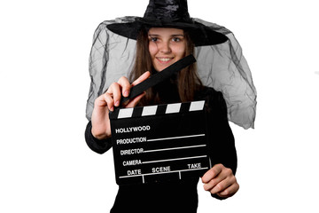 Czarownica z klapsem filmowym. Halloween. - obrazy, fototapety, plakaty