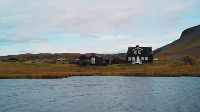 A rural village by a lake in Hellnar, West Iceland