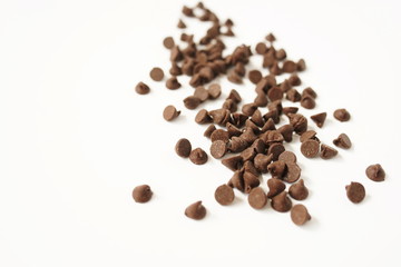 Semi Sweet Chocolate Chips isolated on white background close up.Selective focus.  Top view. Copy space