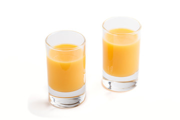 Sweet egg liqueur in glass isolated on white background. Side view