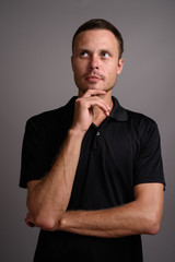 Portrait of handsome man against gray background