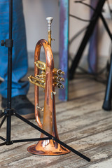 Fototapeta na wymiar Vintage trumpet stands on a stage
