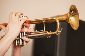 Fototapeta na wymiar Trumpet in trumpeter hands