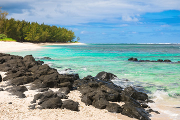 Tropical beach with rocks and transparent ocean in Mauritius