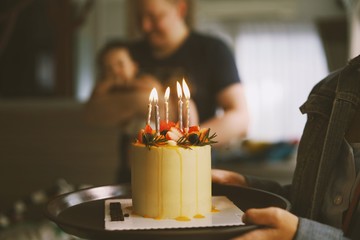 man holding birthday cake 