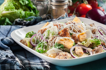 Healthy caesar salad with cheese, eggs and croutons