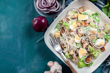 Healthy caesar salad with cheese, eggs and croutons