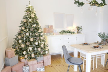 Room with a Christmas tree decorated for the new year