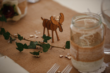 Outdoor catering dinner at the wedding with homemade garnishes decoration