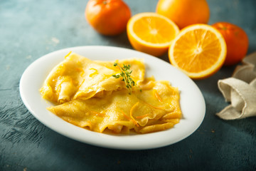 Homemade crepes with orange sauce
