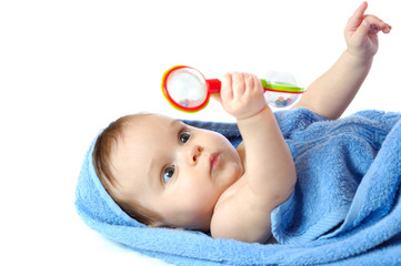 Close-up of a four month old girl with a rattle