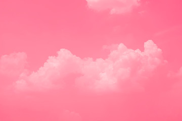Fototapeta premium Pink sky background with white clouds.
