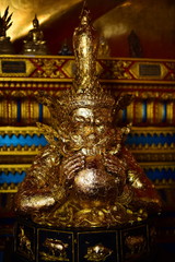 Fototapeta premium Golden statue of buddha in temple, Thailand