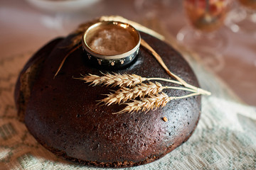 Black bread loaf with rye bells.