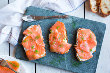 Sandwithes with smoked salmon and creamy cheese on bread