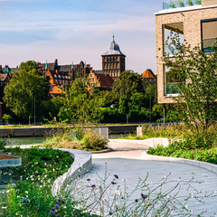 Lübeck with modern apartment complex and view to the castle gate