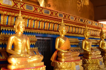 Golden statue of buddha in temple, Thailand