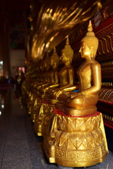 Fototapeta premium Golden statue of buddha in temple, Thailand